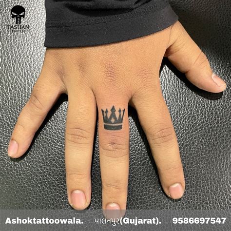 crown tattoo finger